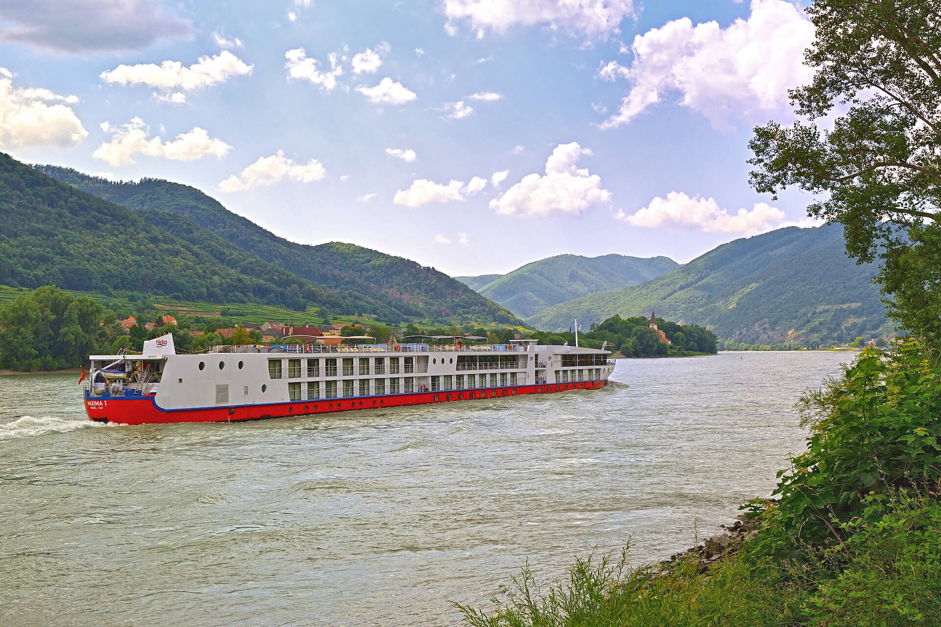A river cruise ship traveling on the Danube River
