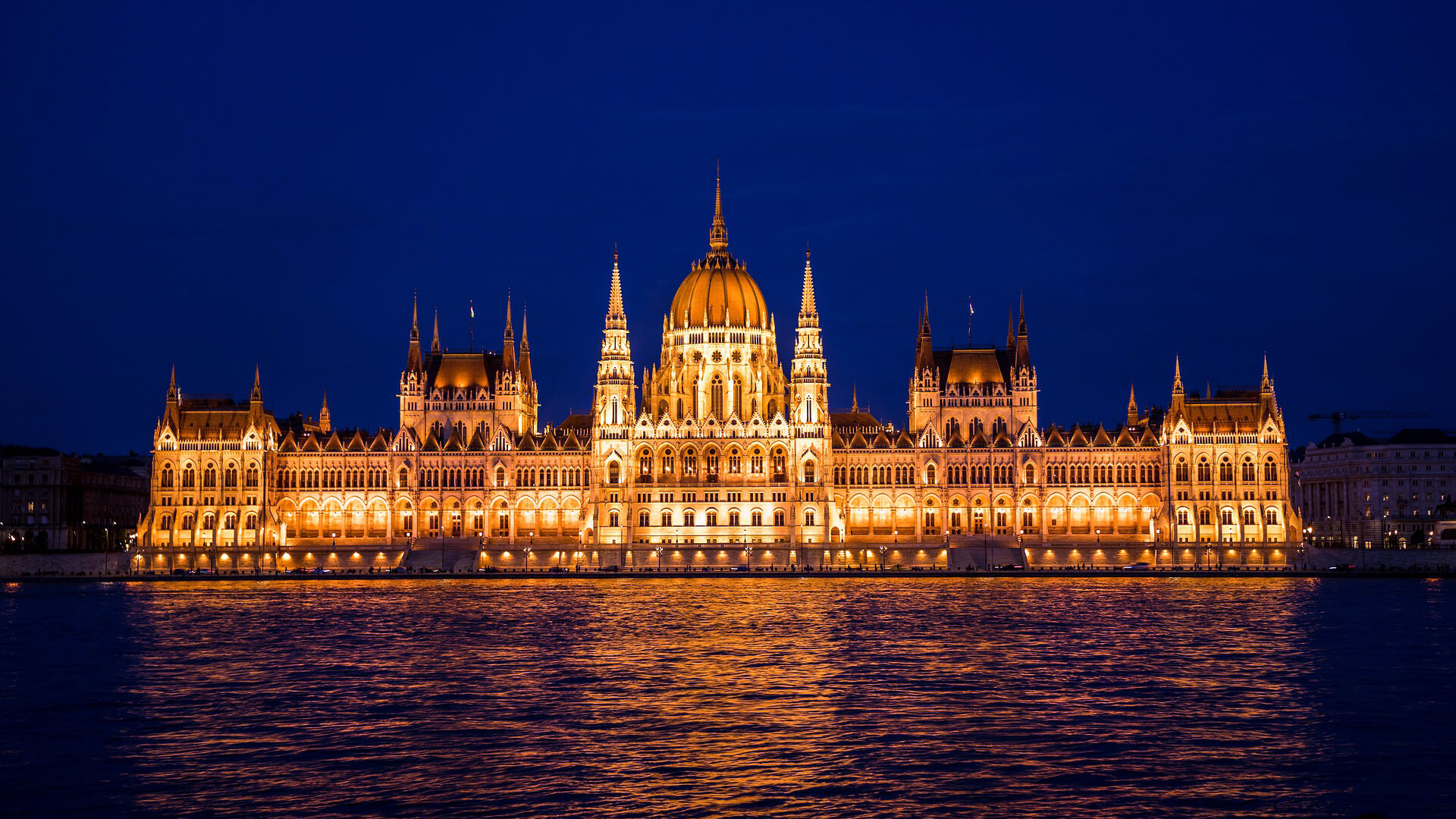 <br />
photo of the illuminated Hungarian Parliament at night