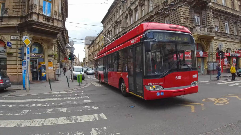 Red trolleybus traveling on line 76 in Budapest